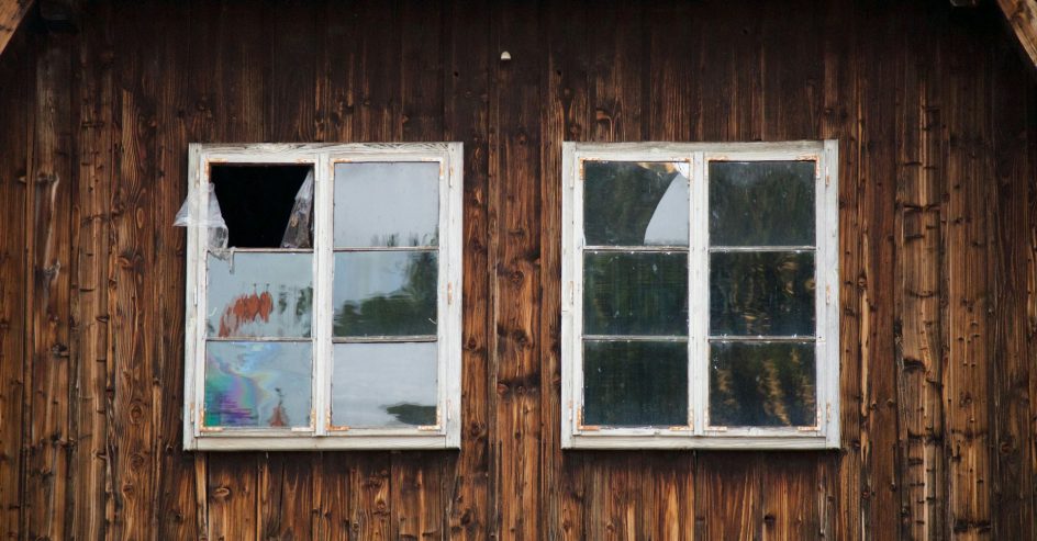 White framed windows on wooden building exterior
